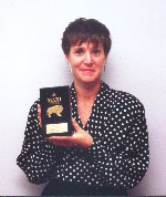 Judy Krawchuk, Marketing Manager of Willowbrook Shopping Centre, holding the prestigious MAXI Award